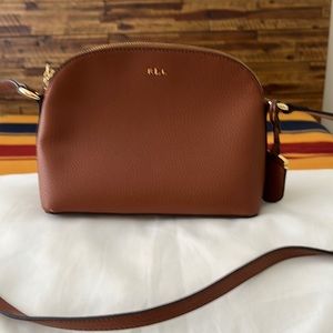 A Ralph Lauren handbag In Brown Leather…with a adjustable strap.Right size..